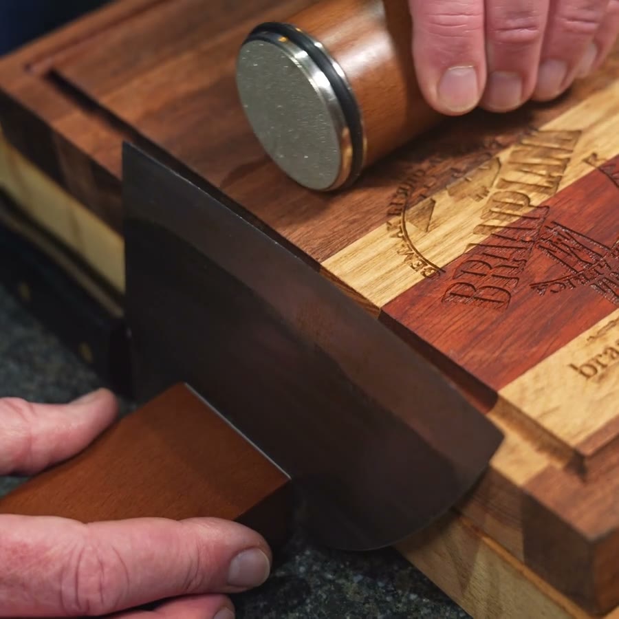 BraaiPlank Diamond Rolling Sharpener on a knife with the magnetic angle block